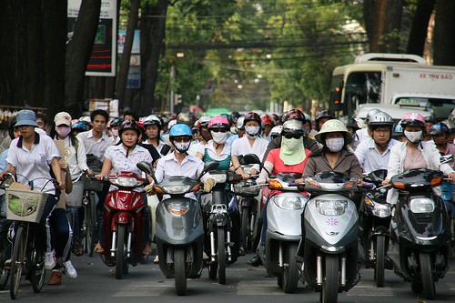 motorbike riders wearing masks