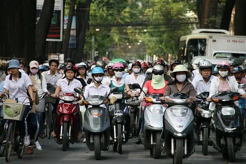 motorbike riders wearing masks