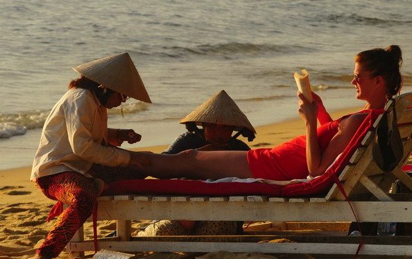foot massage on beach