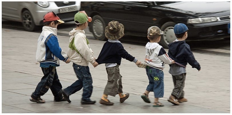 Local children crossing the road in Saigon, although we recommend that they have adults on either side of them.