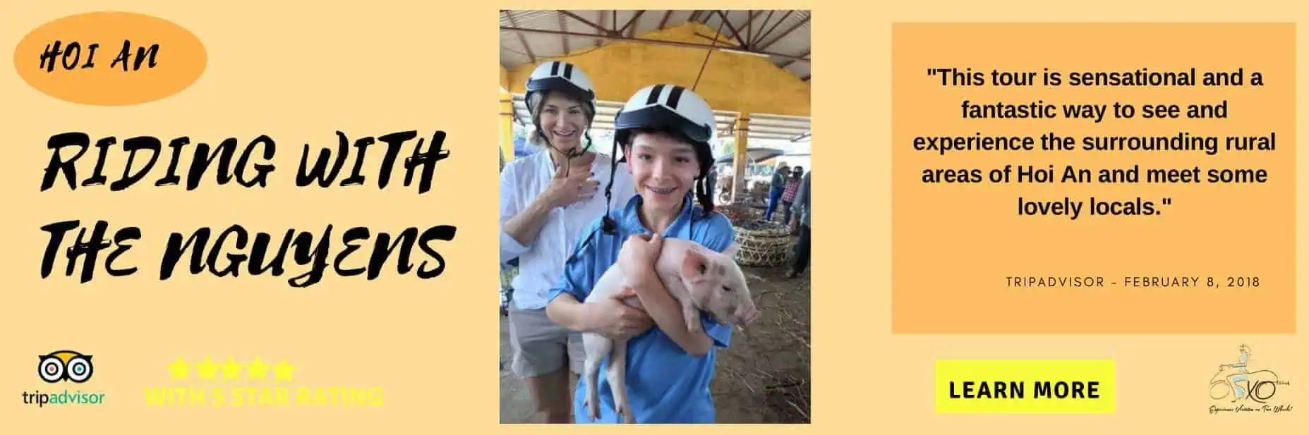 kid holding a pig in Hoi An