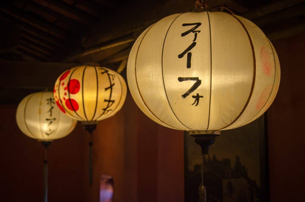 Lanterns with Japanese writings are lit all over Hoi An at night