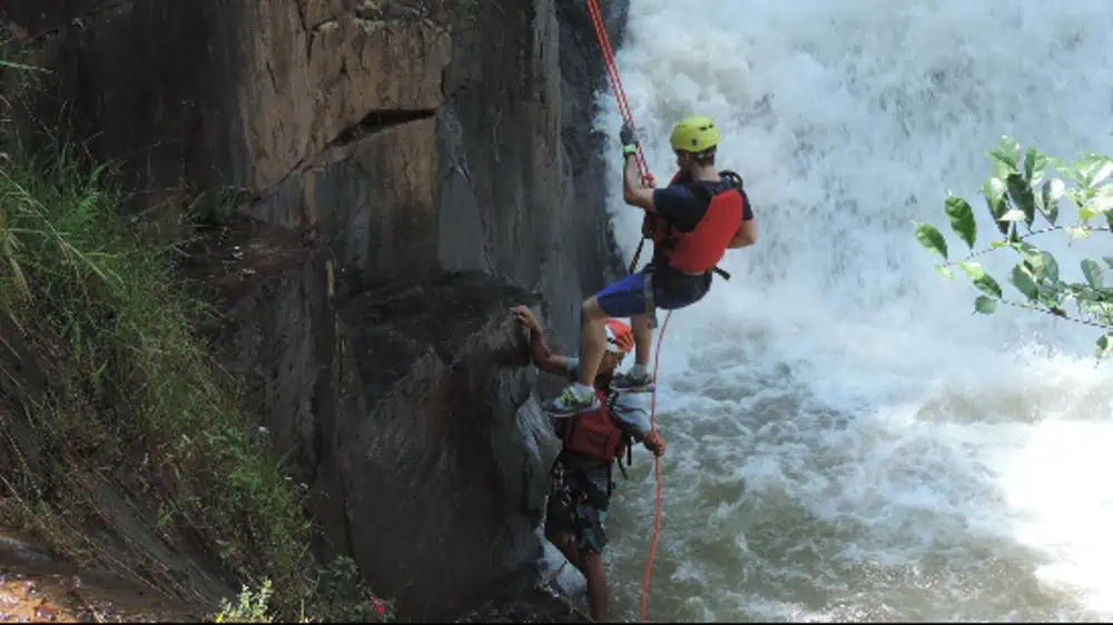 Rappelling down a cliff in Dalat 