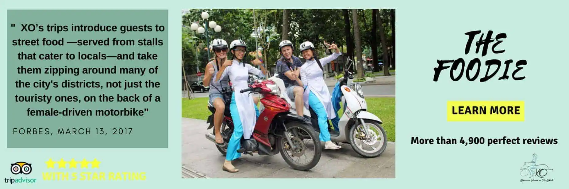 XO girls posing with guests on scooters