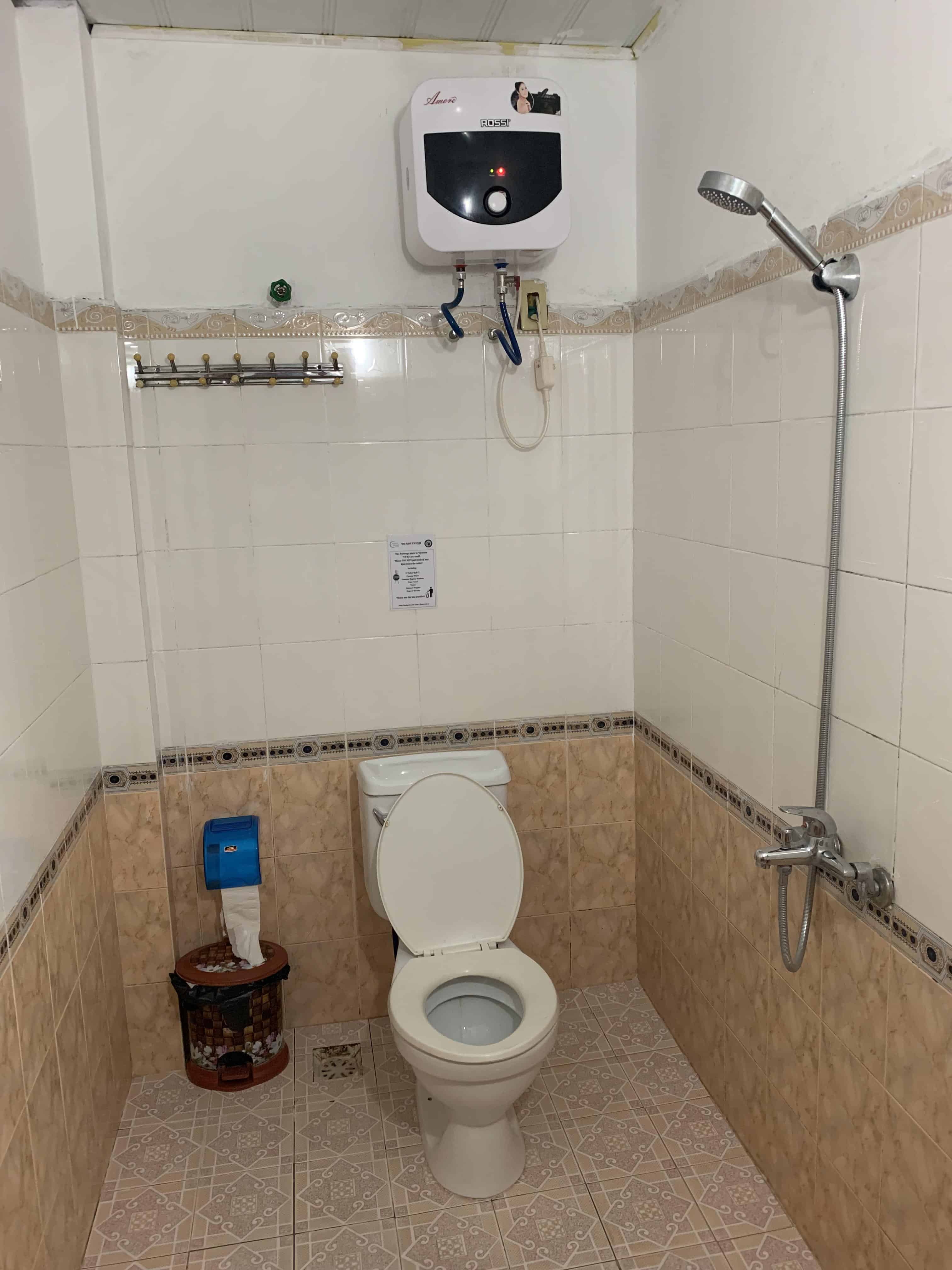 No divider between shower and toilet