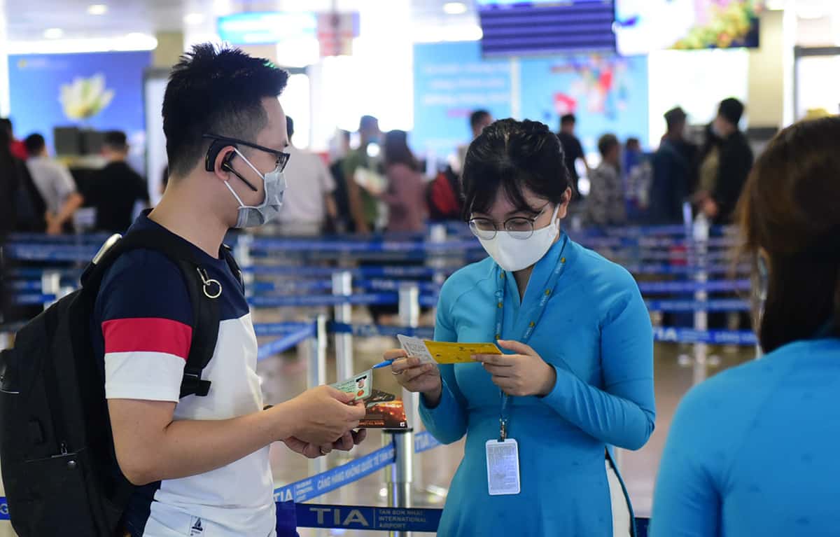The airline staff at Vietnam airport helping customers with boarding and customs